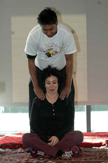 Ken giving shiatsu therapy to Ruby Wax at an event in London